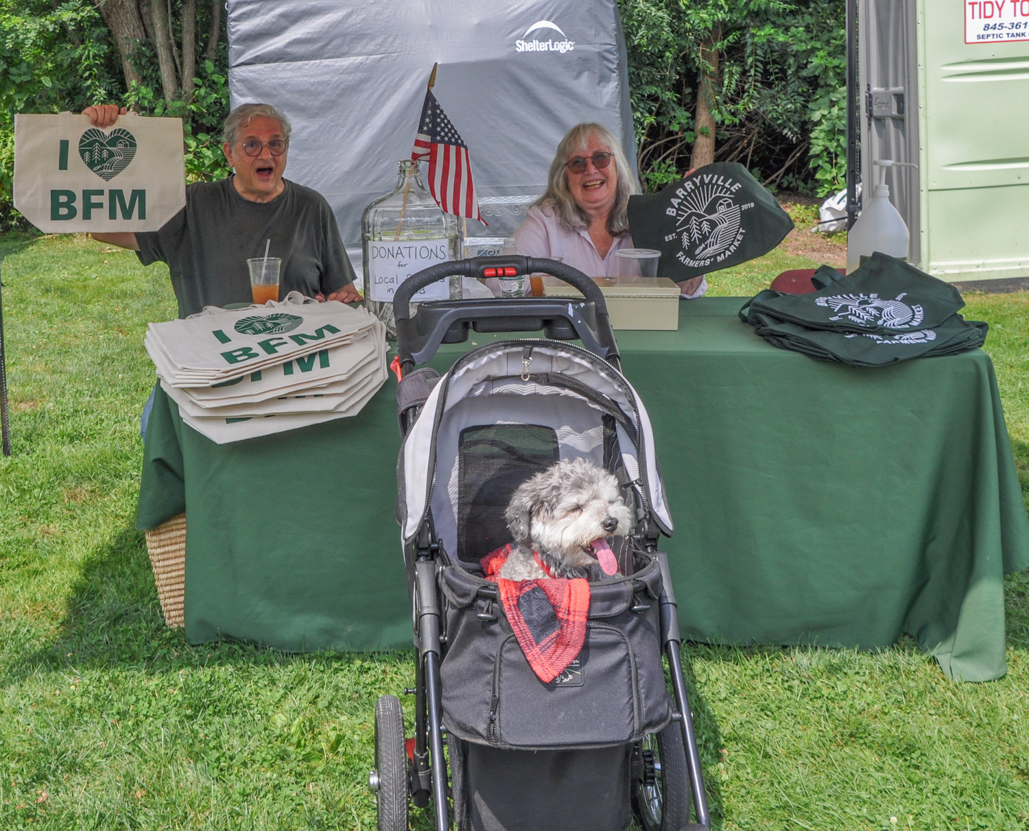 Barryville Farmers Market volunteers Richard Malenky and Nancy Handler were happy to "spread sunshine all over the place," which made my dog smile in her stroller. Don't judge!